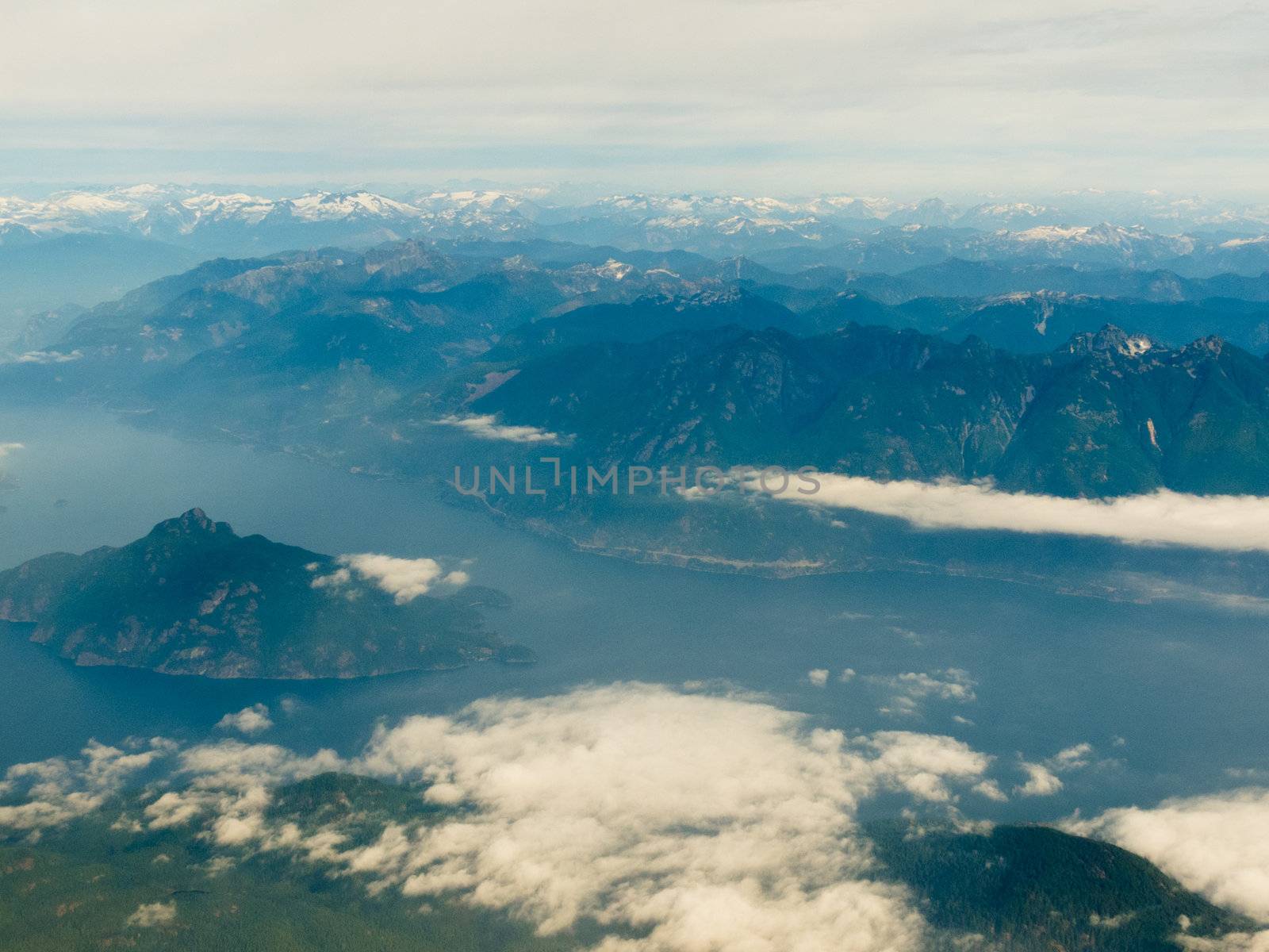 Aerial view of west coast mountain ranges and fiords of Pacific Ocean in western province of beautiful British Columbia, Canada.