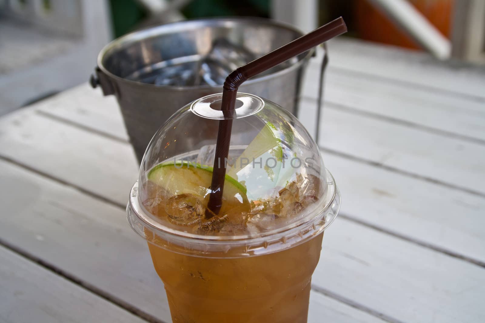 Apple tea with ice and apple pulp.