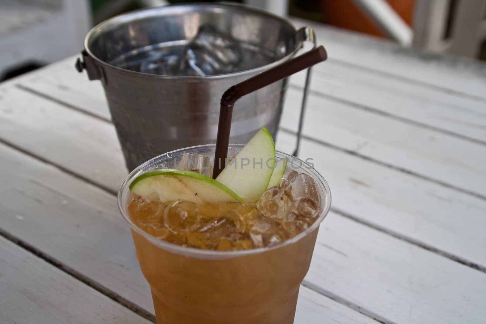 Apple tea with ice and apple pulp.