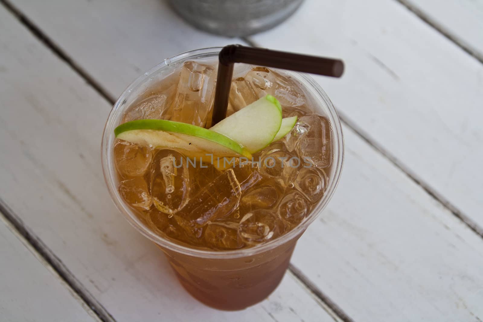 Apple tea with ice and apple pulp.