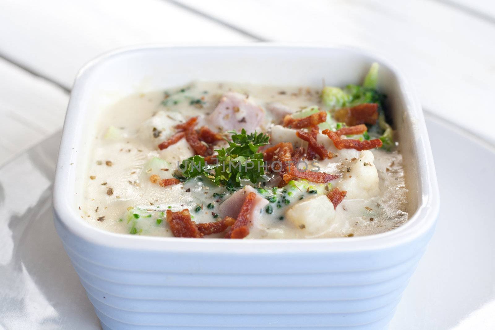 Broccoli, Potato and Bacon baked cheese sprinkle with parsley.