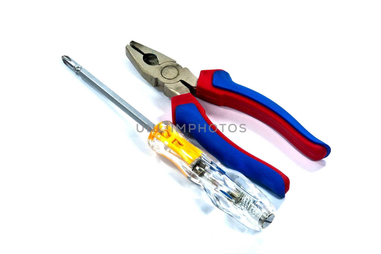 Pliers and Screwdriver for repair on white background.