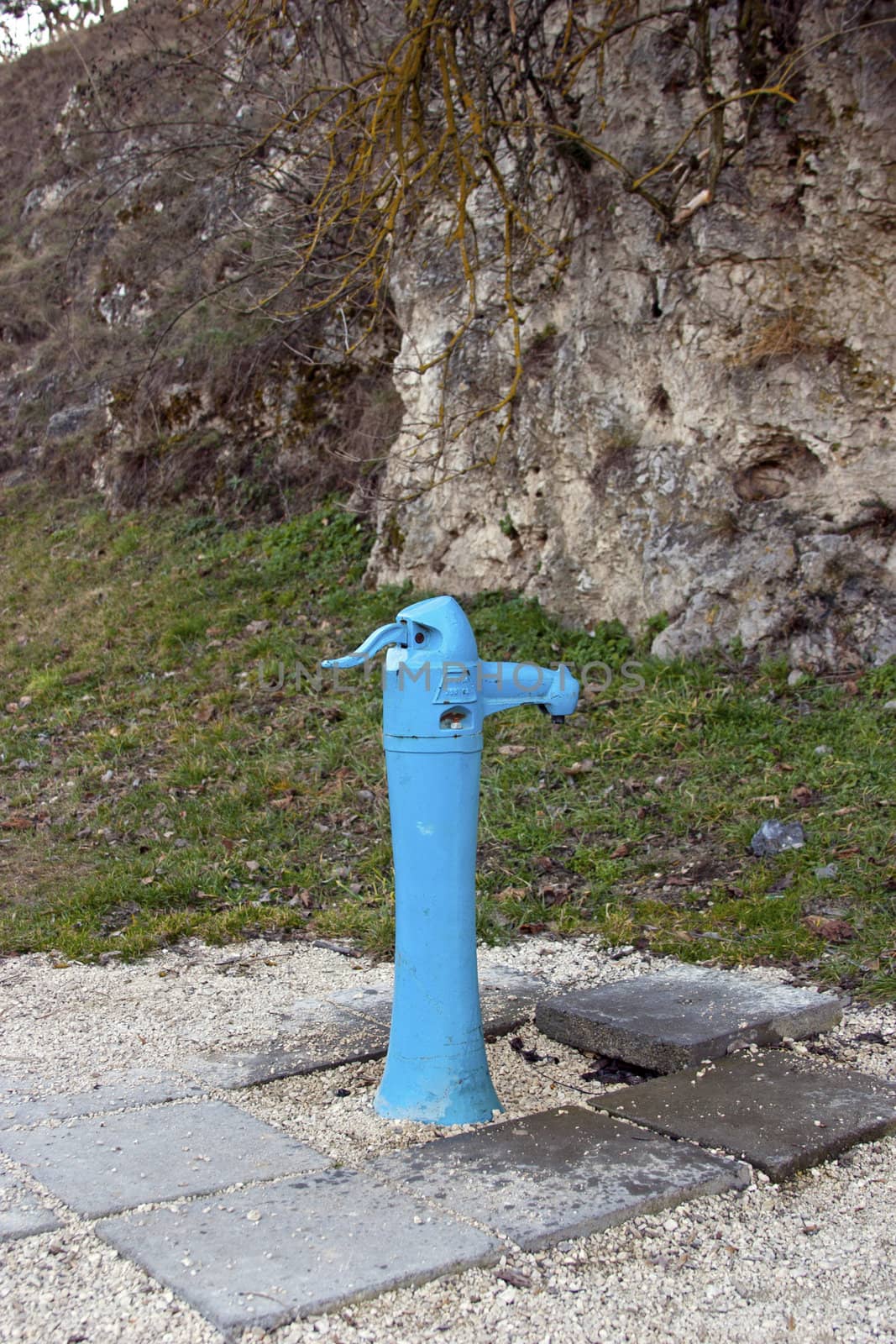 A typical blue street fountain in a park