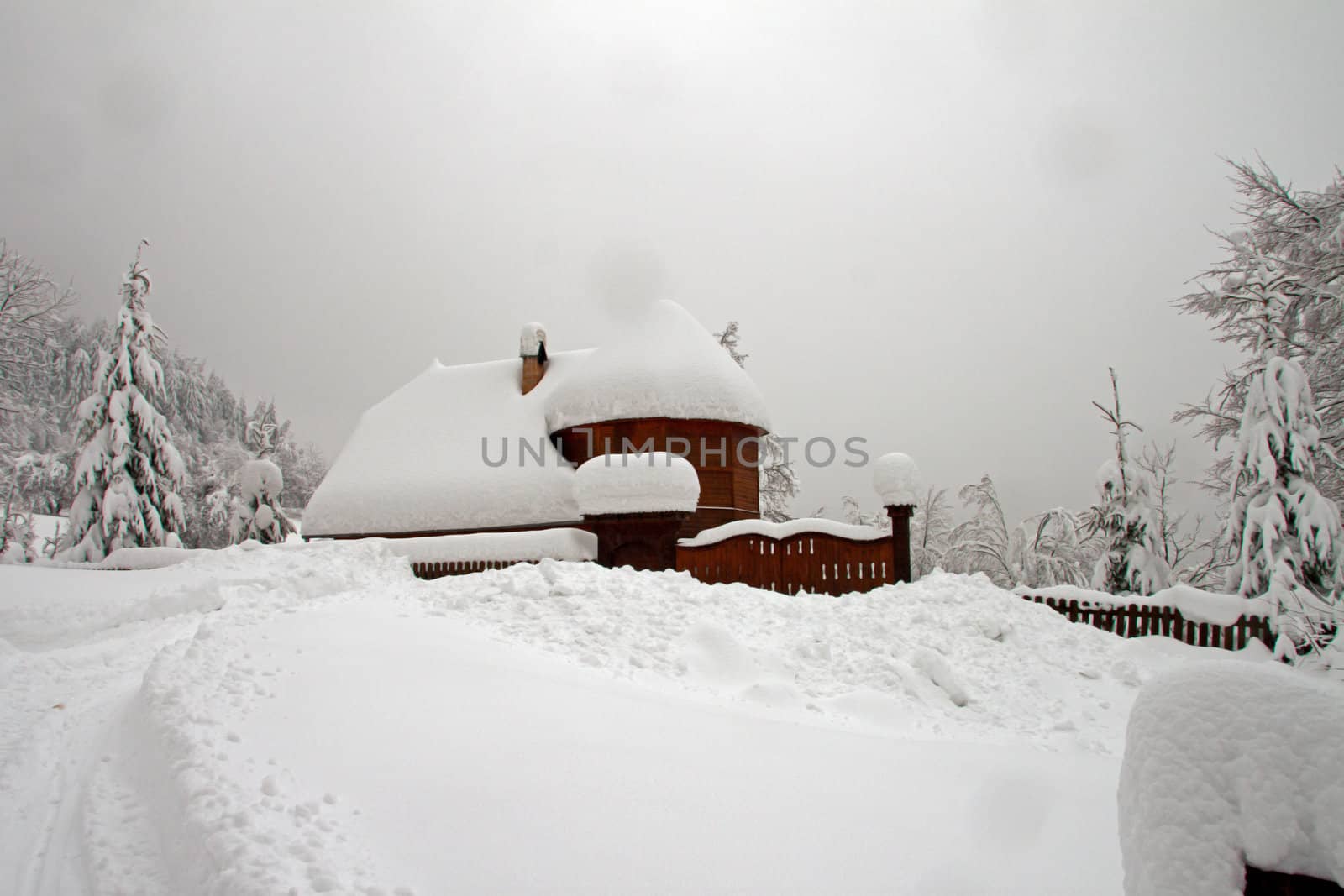 A lonely wooden house in the snow by renegadewanderer