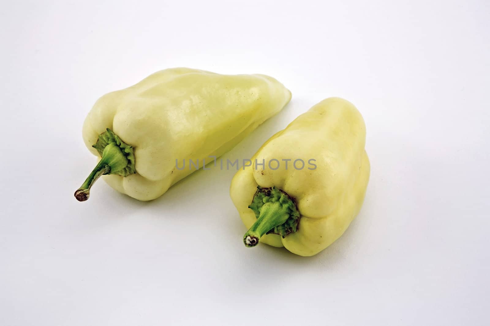 Two sweet hungarian peppers on white background