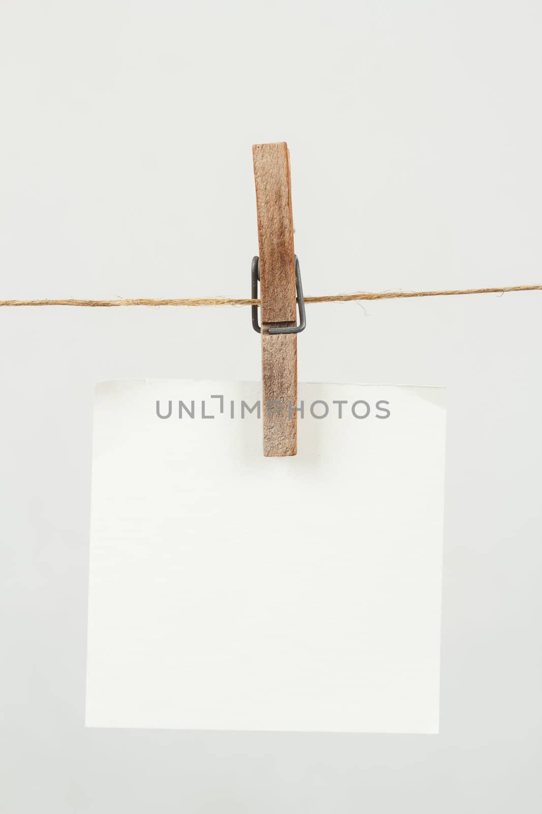 white memory note paper hanging on cord
