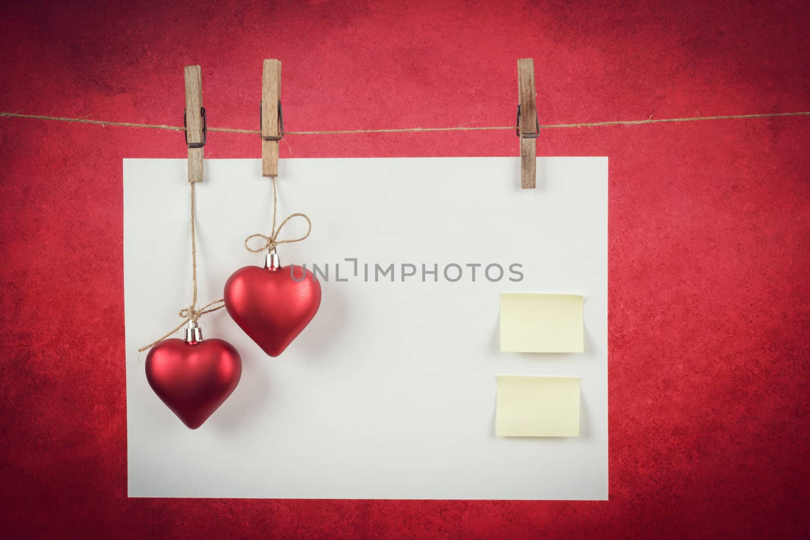empty note for valentine message on red background