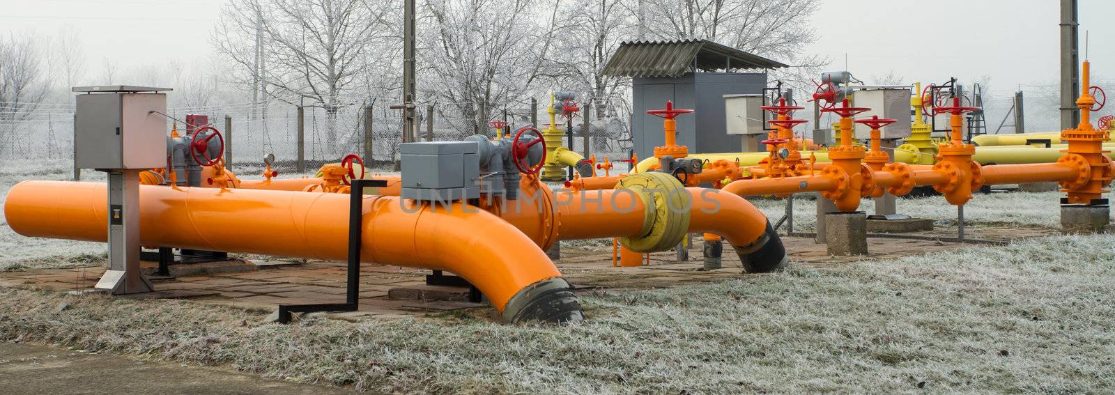 orange gas pipe in frosted winter