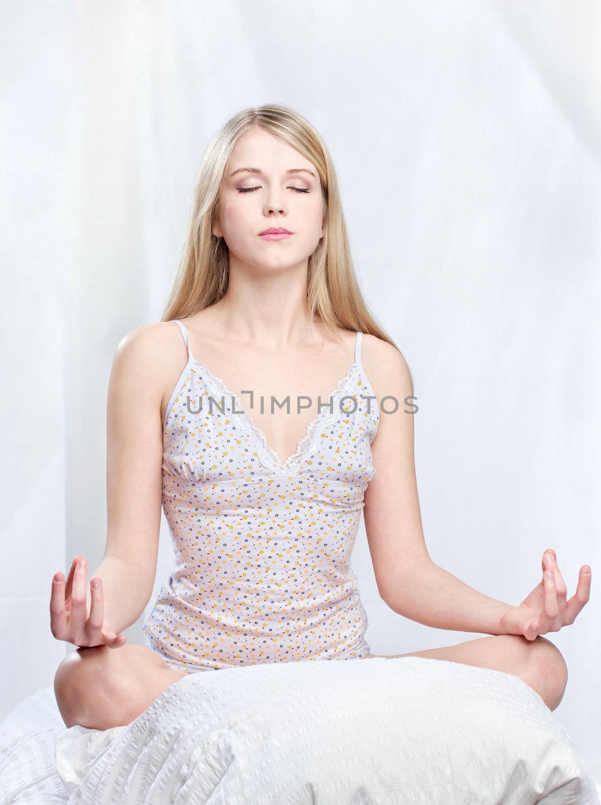 Young woman meditate at home