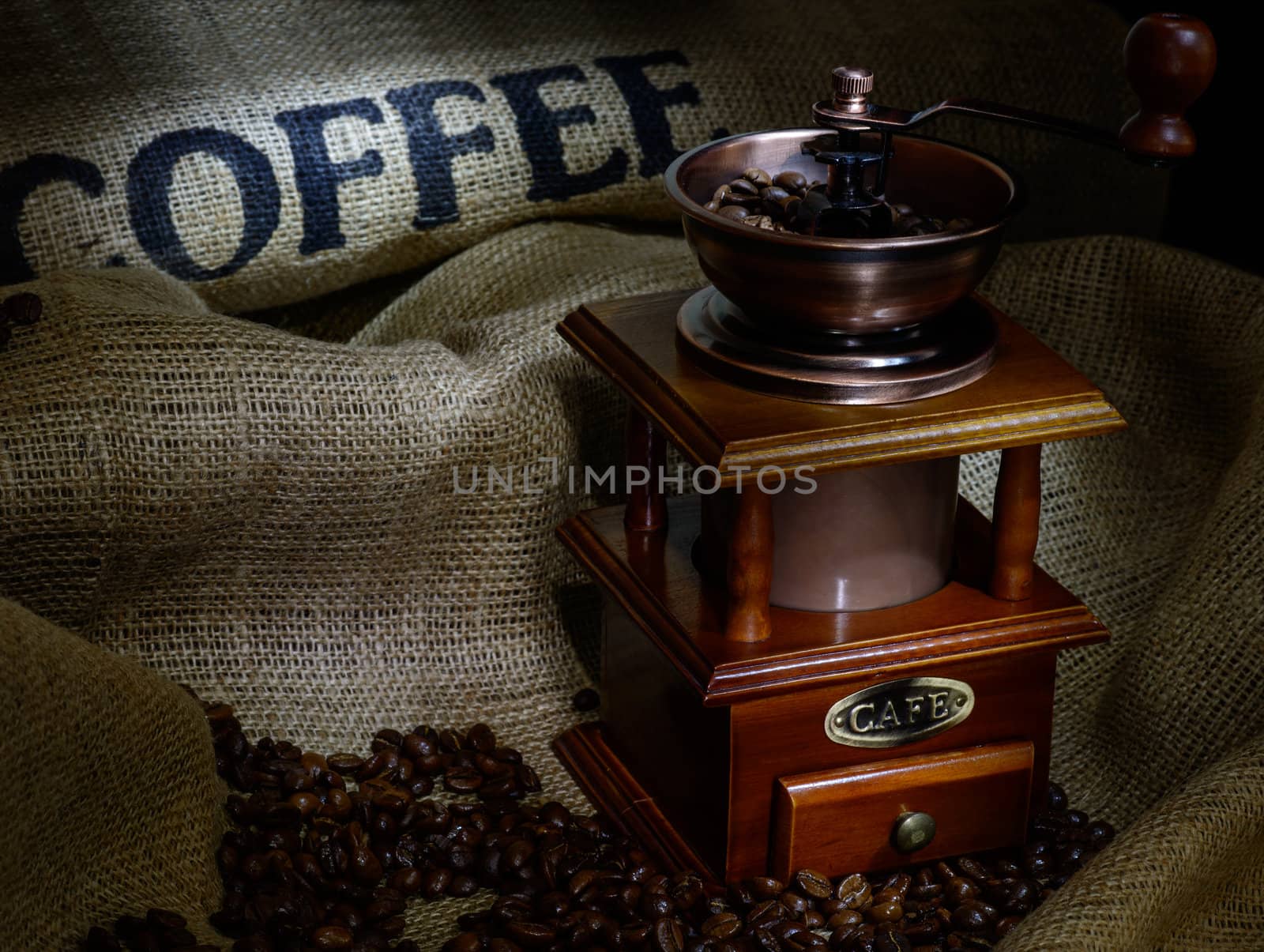 Coffee Mill with beans and burlap. still life