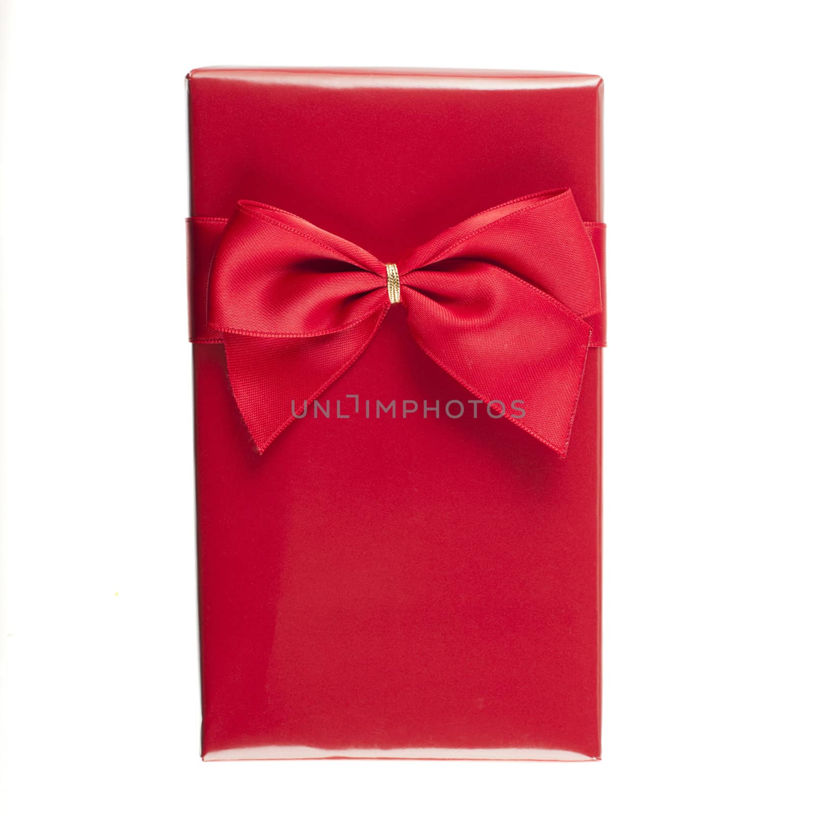 Gift wrapped with red paper and red ribbon in white background