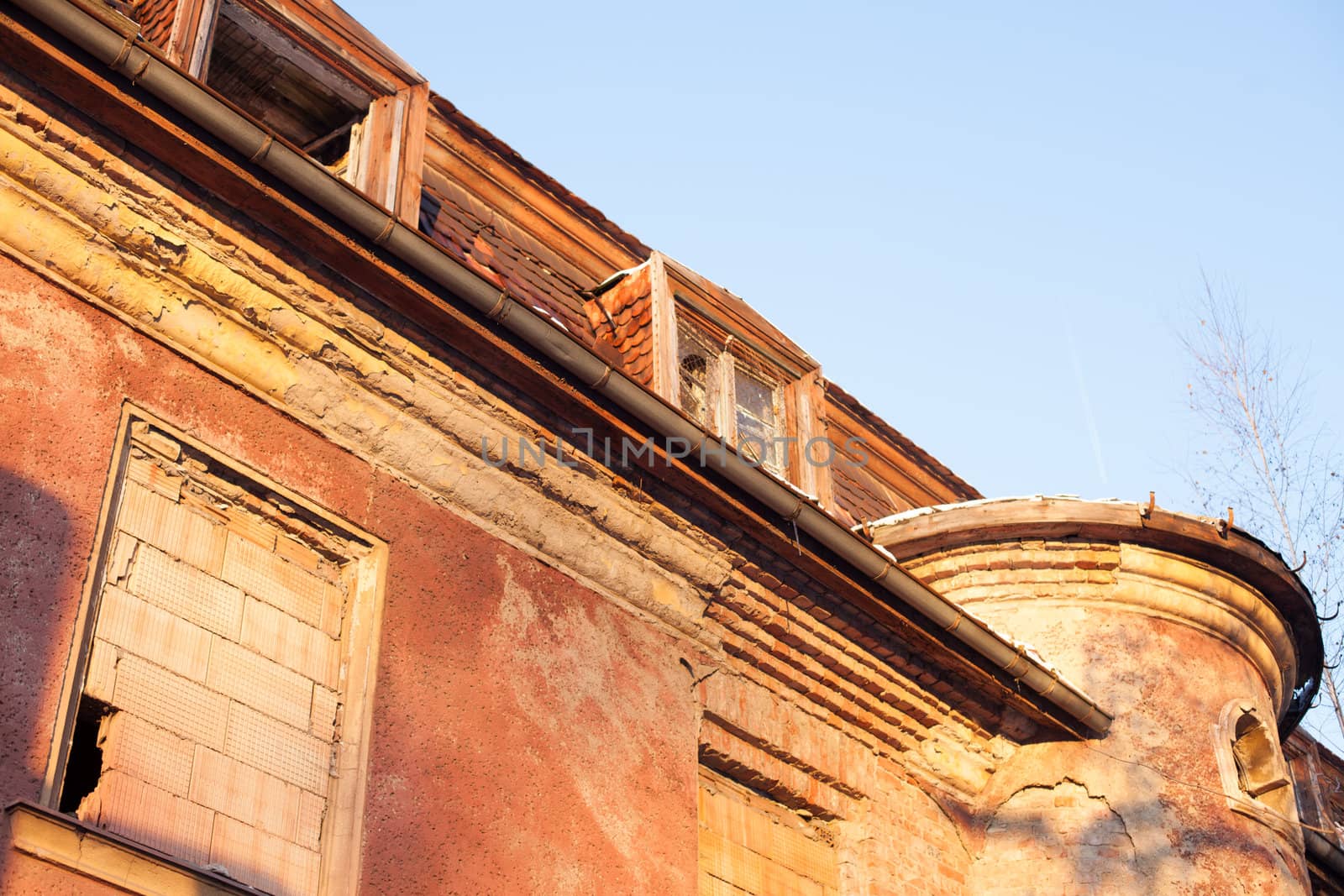 Abandoned house sealed with bricks in winter