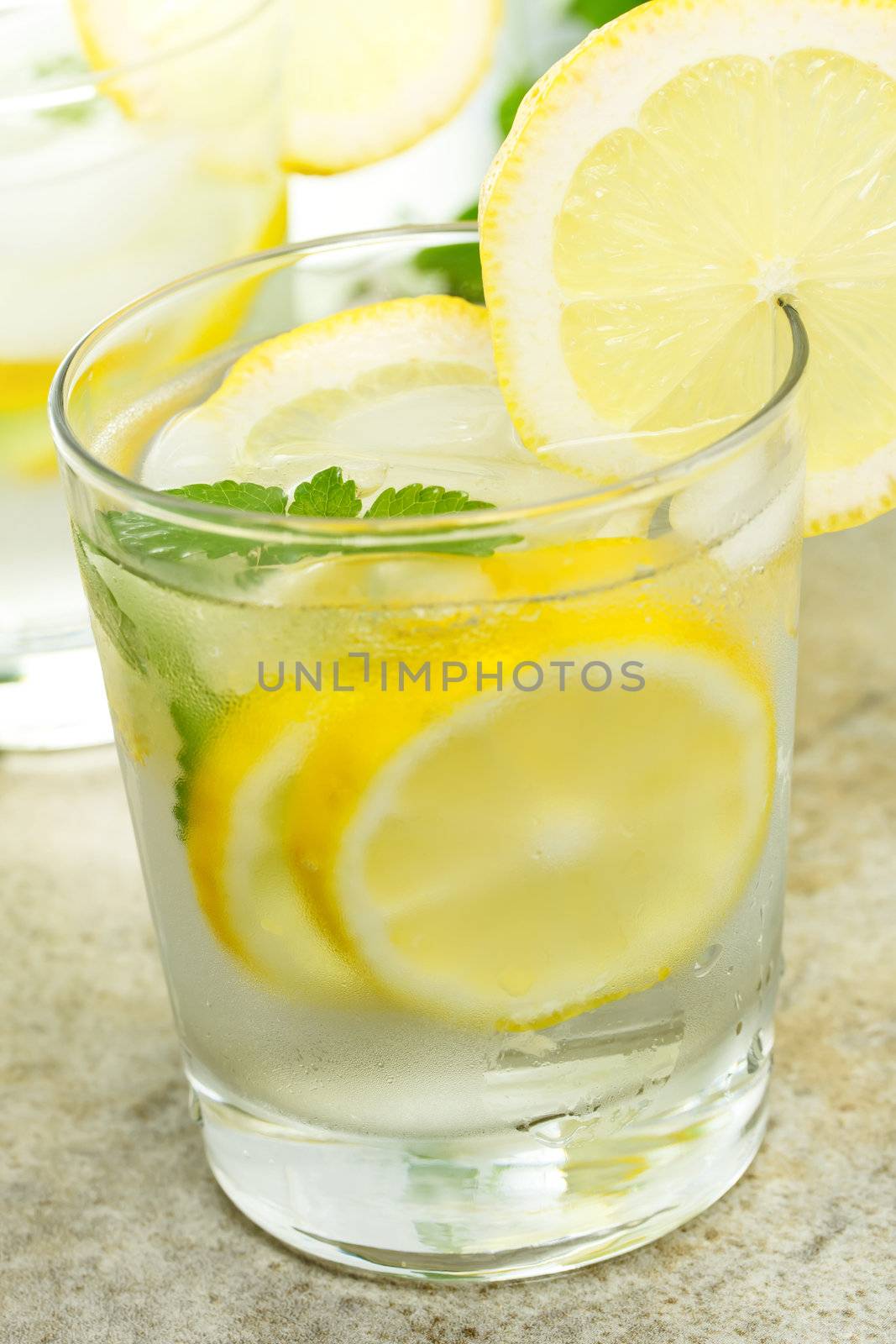 Fresh Lemonade in a Glass with Lemon Slices 