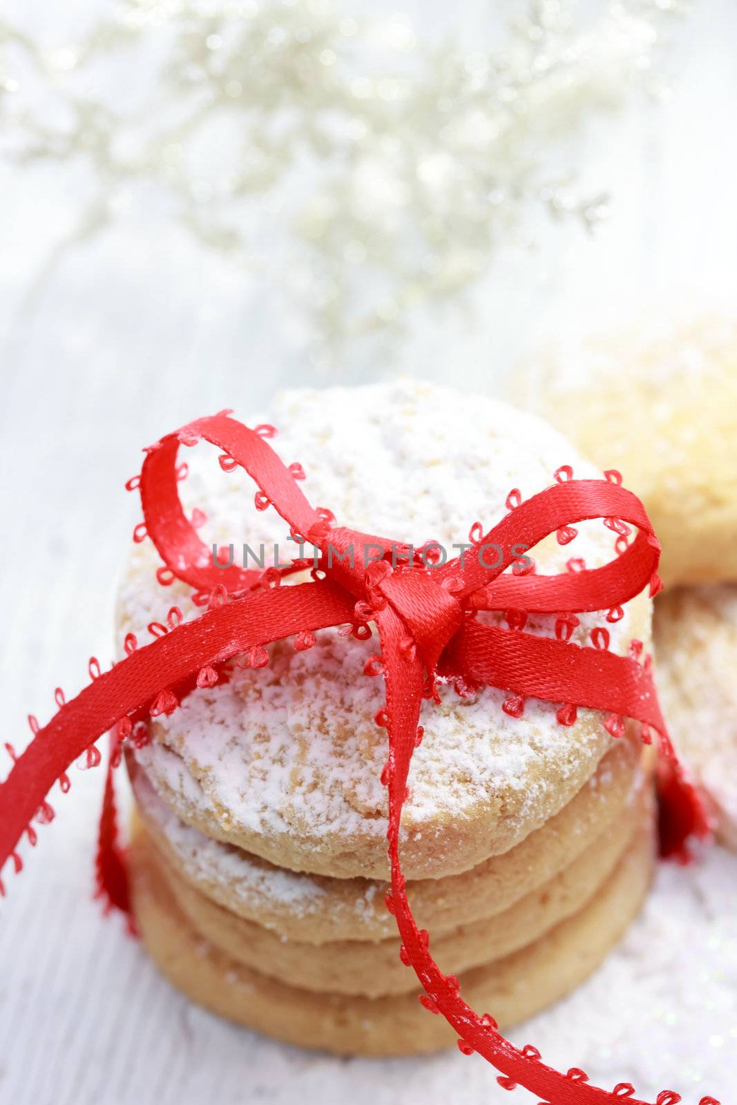 Christmas powdered cookies with red ribbon