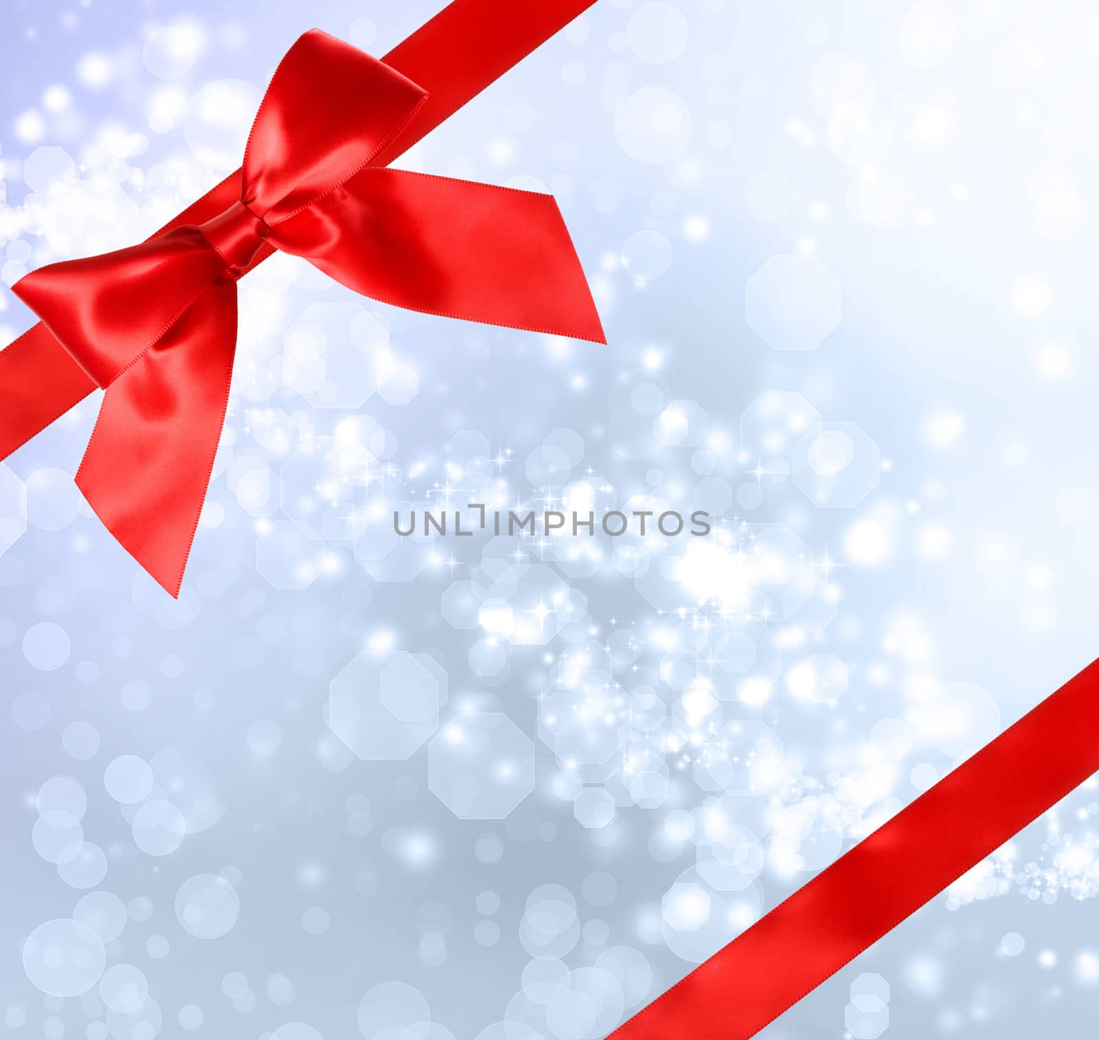 Red Bow and Ribbon with Blue Bokeh Lights Background 