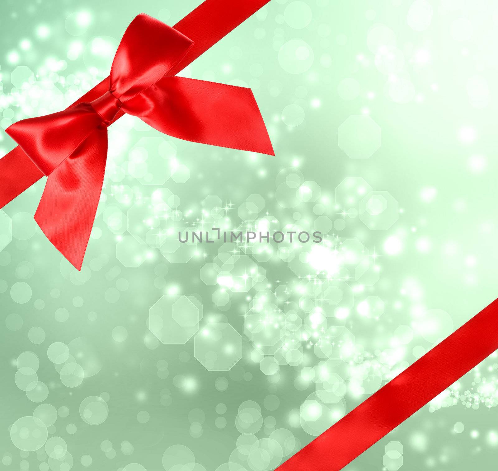 Red Bow and Ribbon with Green Bokeh Lights 
