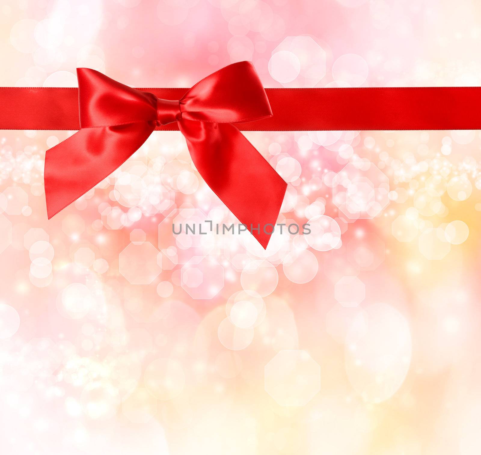 Red Bow and Ribbon with  Pink Bokeh Lights Background 