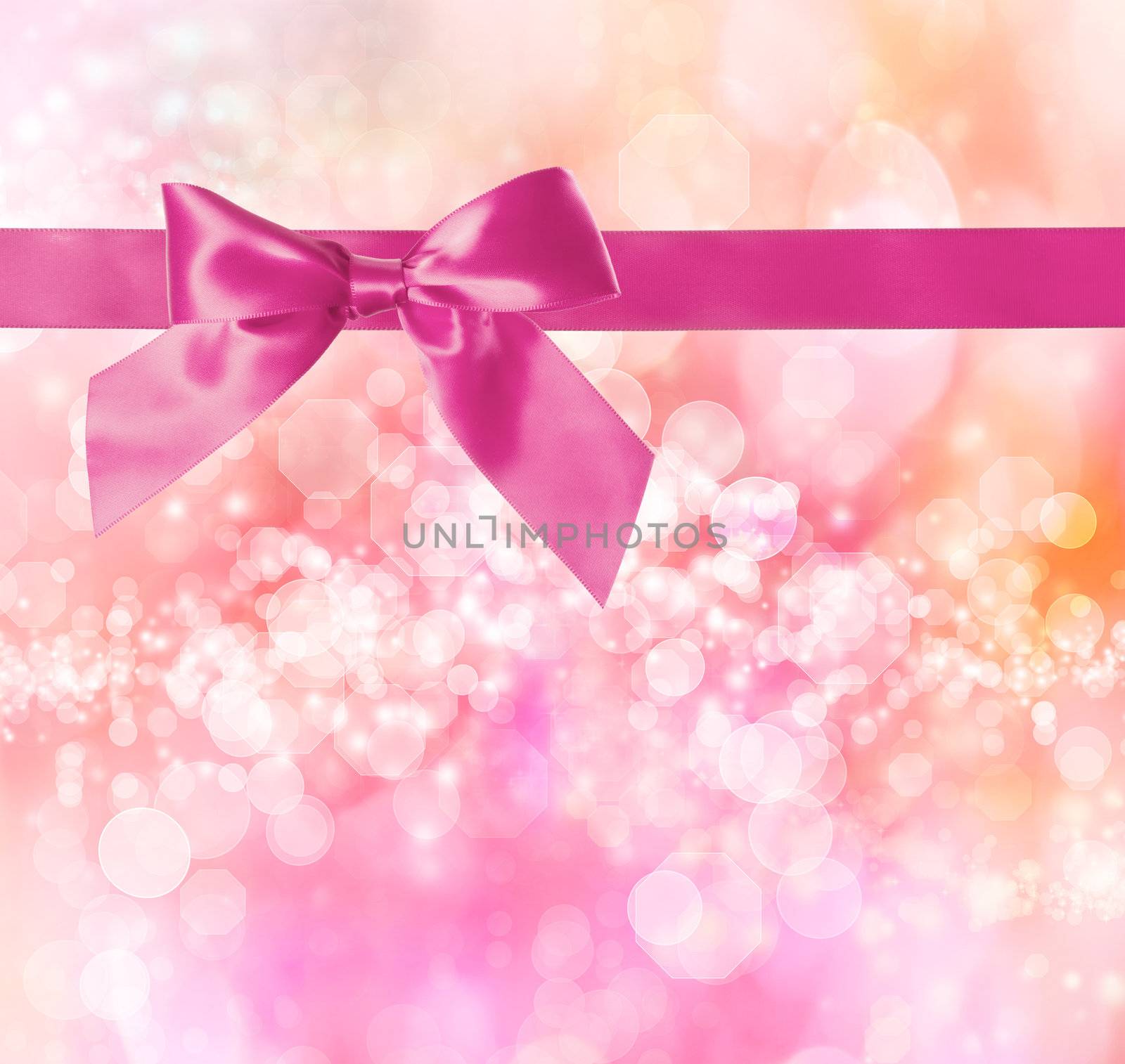 Pink Bow and Ribbon with Pink Bokeh Lights Background 