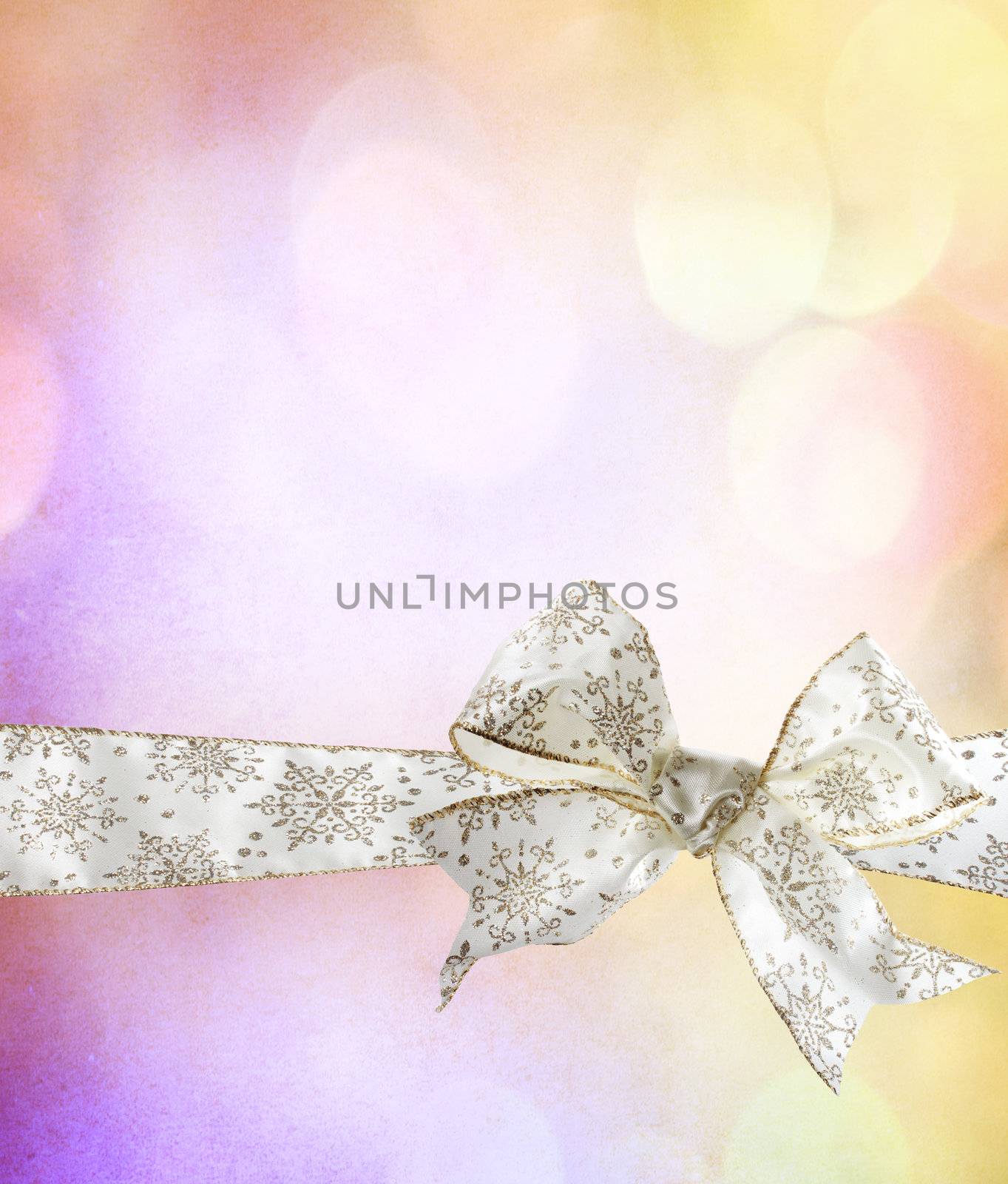 White Snowflake Bow and Ribbon with Abstract Lights Background 