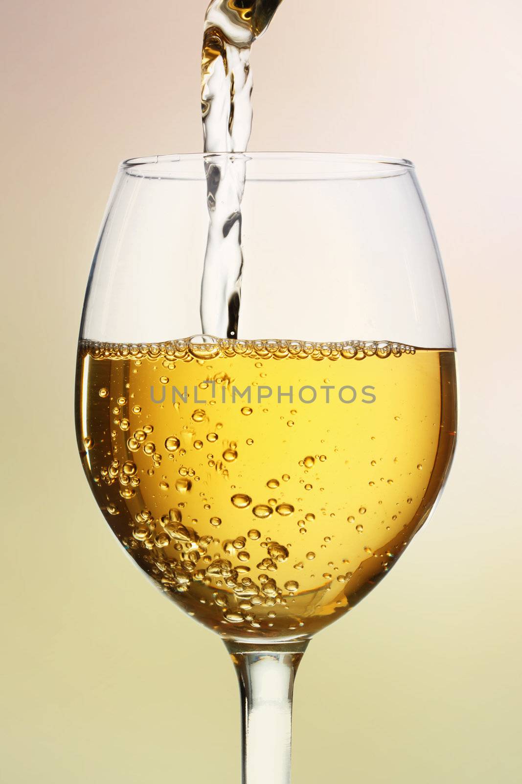 White wine being poured into a wine glass