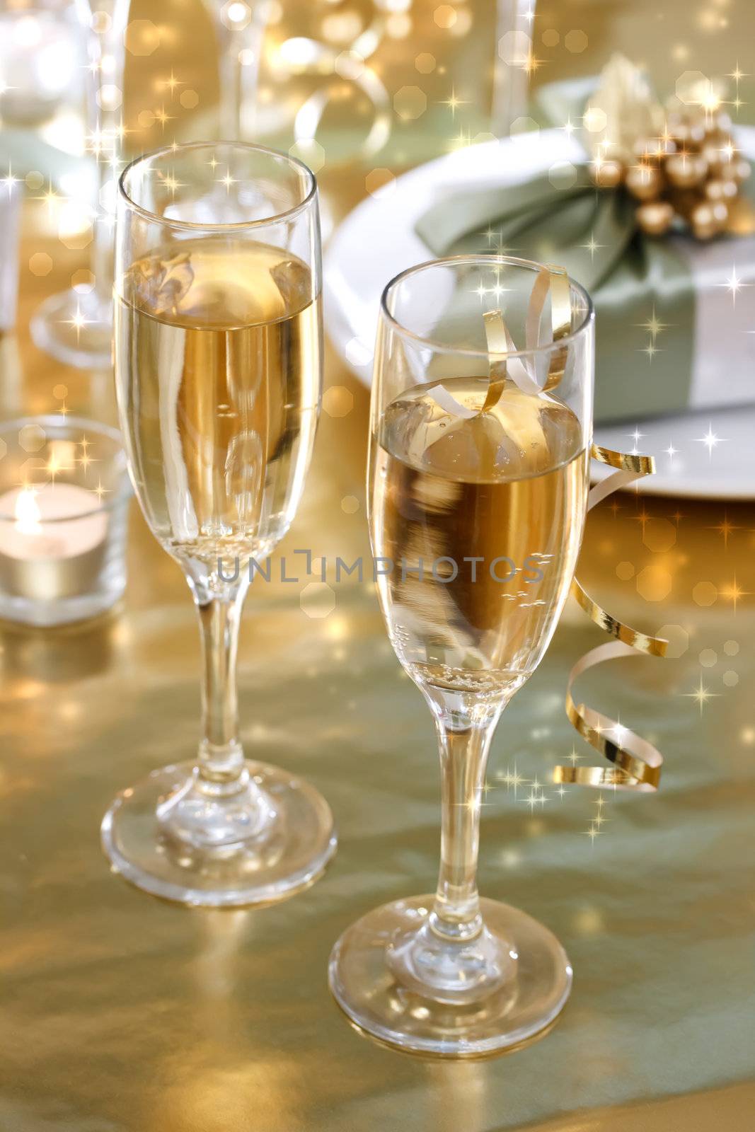 Champagne glasses on the dinner table by melpomene