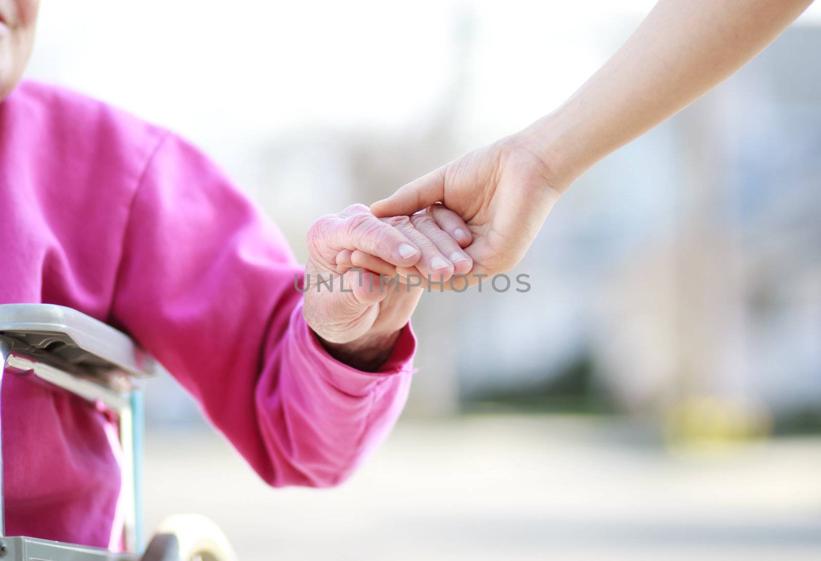 Senior Lady in Wheelchair Holding Hands by melpomene