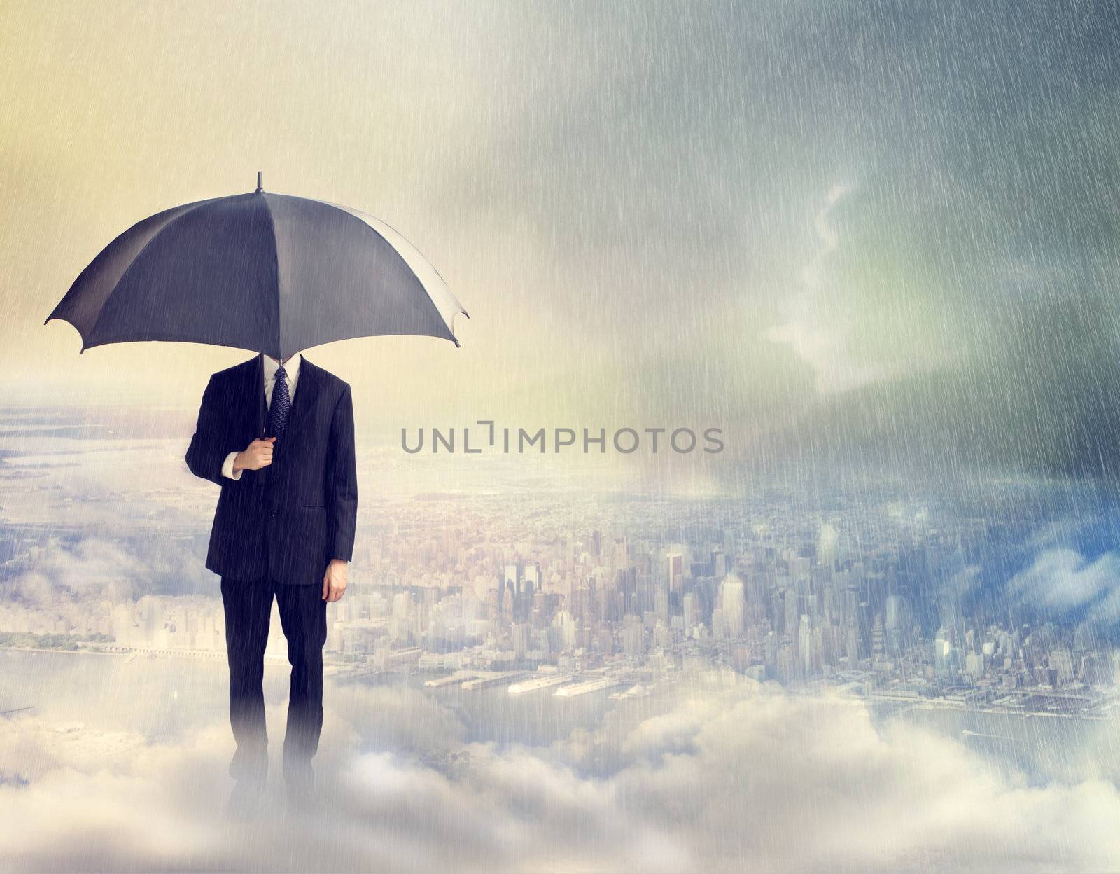 Business Man with Umbrella Above the City