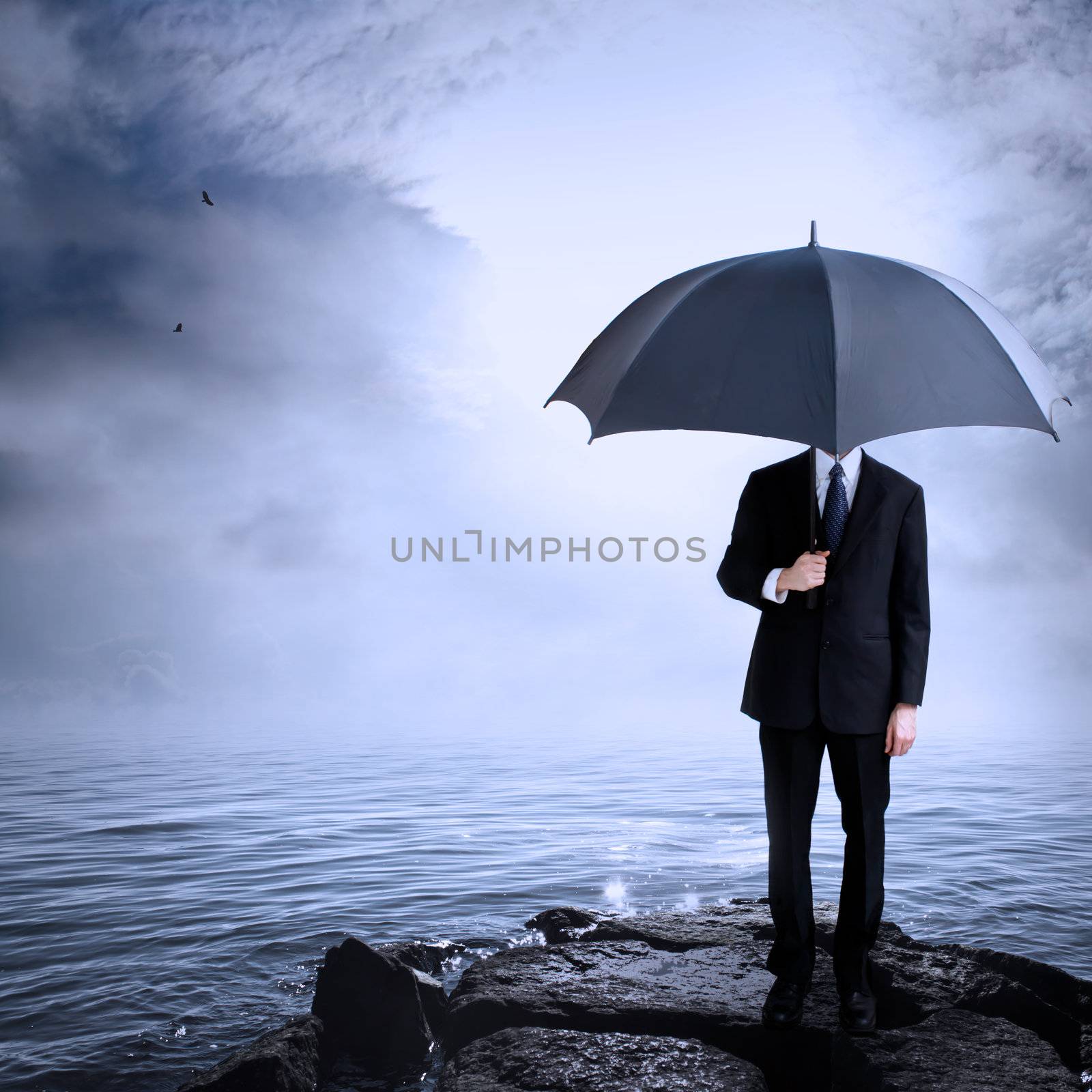 Business Man Holding Umbrella at the Coast After or Before a Storm