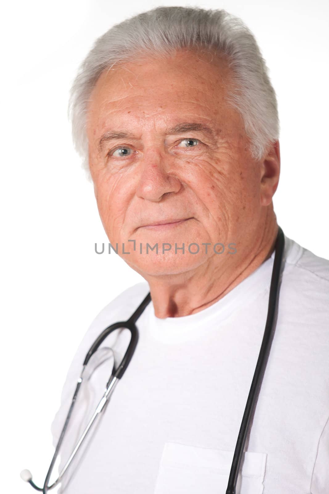 Senior male doctor with grey hair friendly with stethoscope
