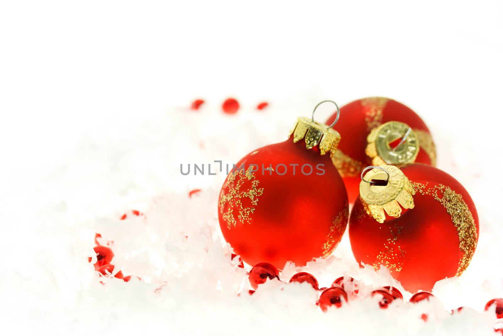  Red Christmas ornaments on snow