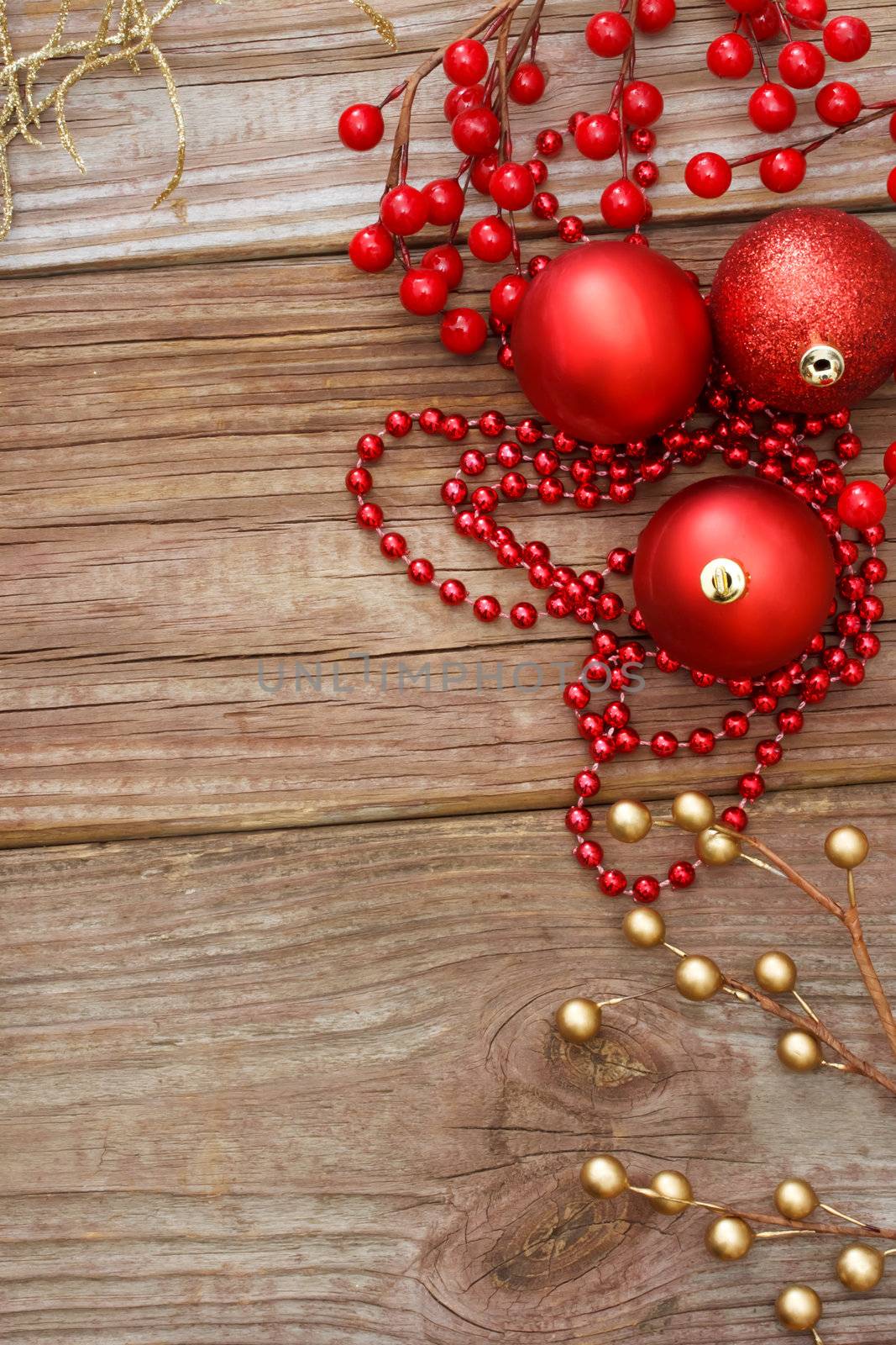 Red Christmas ornaments on wood