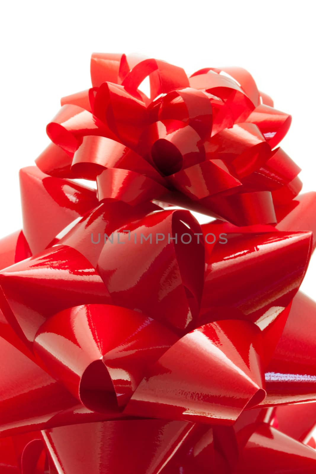 Red gift bows isolated on white background