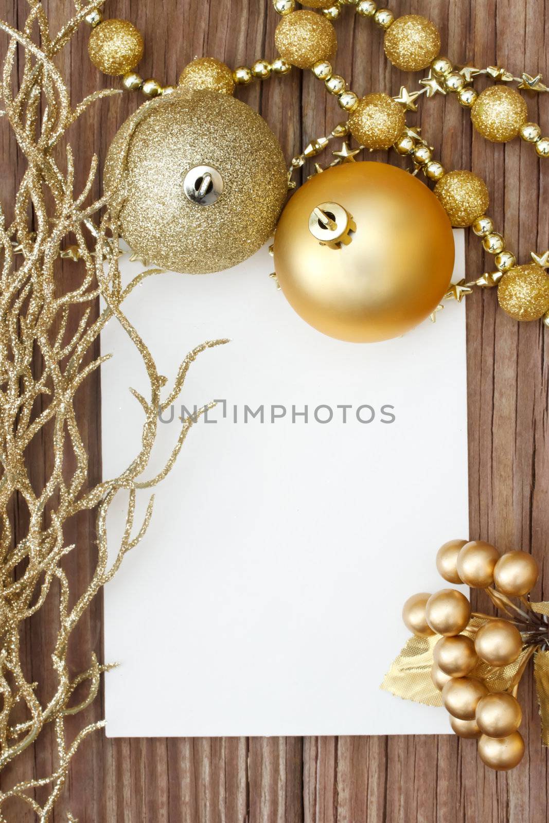 Gold Christmas ornaments on wood 
