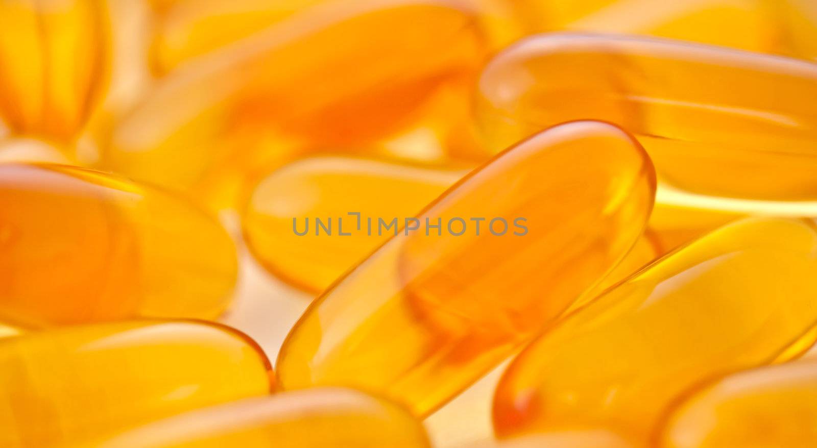 Close up image of yellow gel capsules
