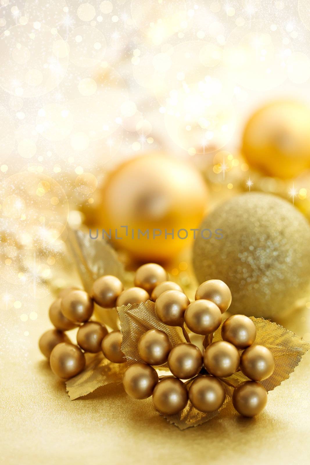 Christmas gold color ornaments over shiny background
