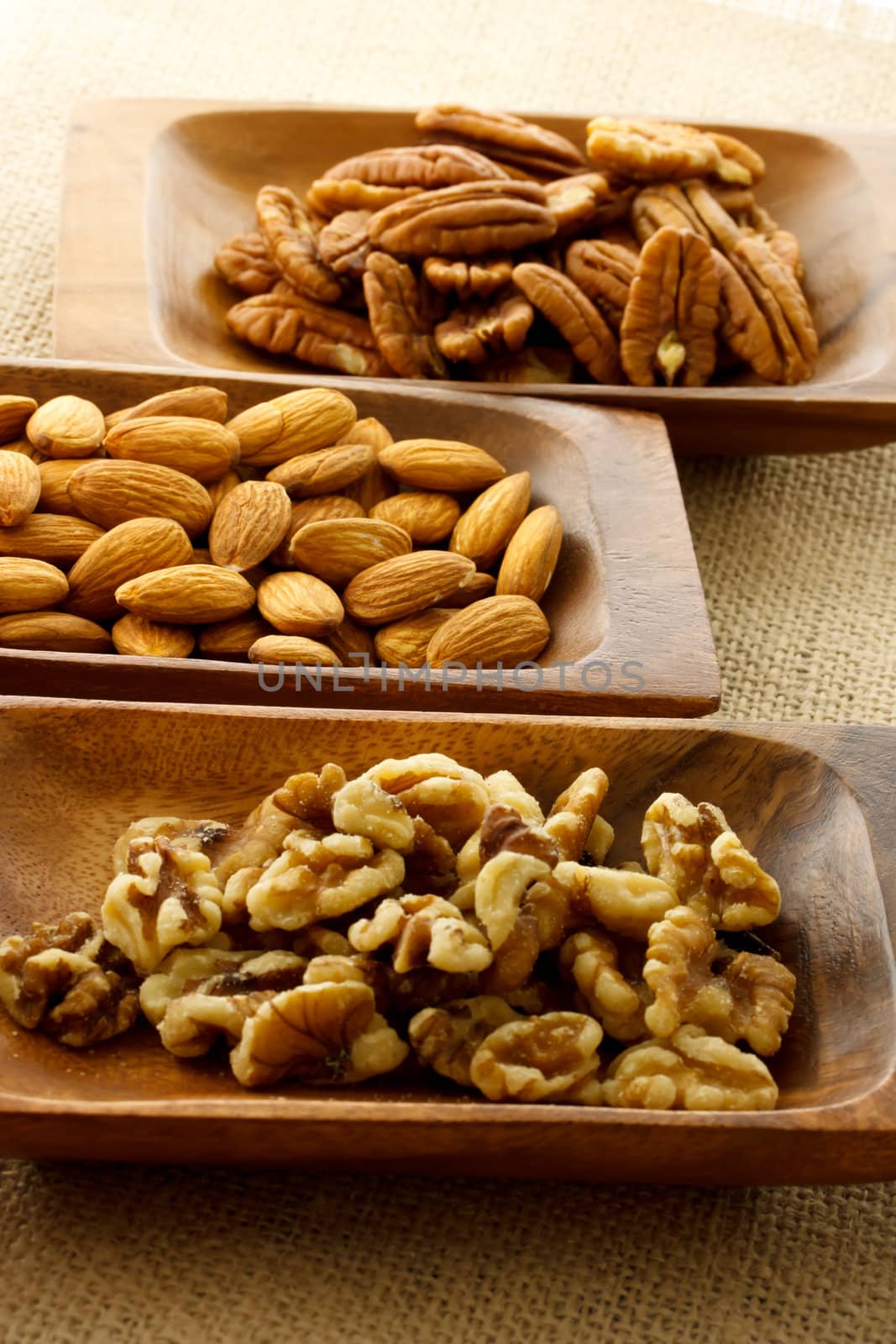 Assortment of nuts in wooden plates