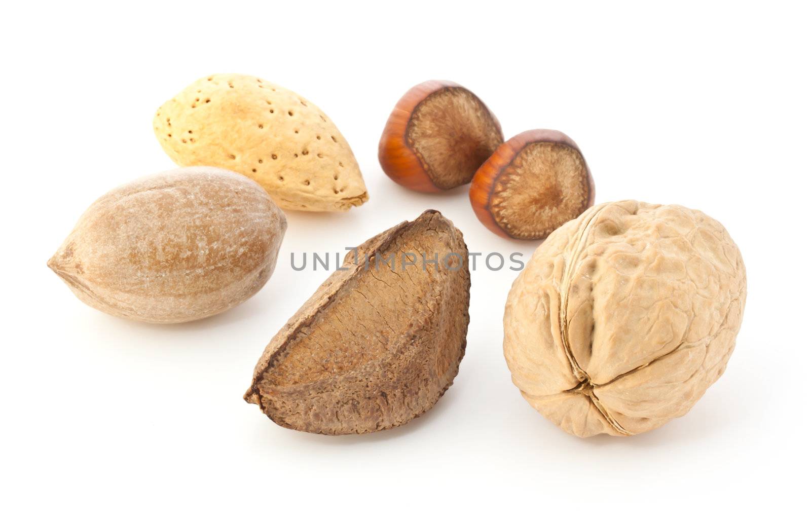 Mixed nuts in the shell isolated on white background