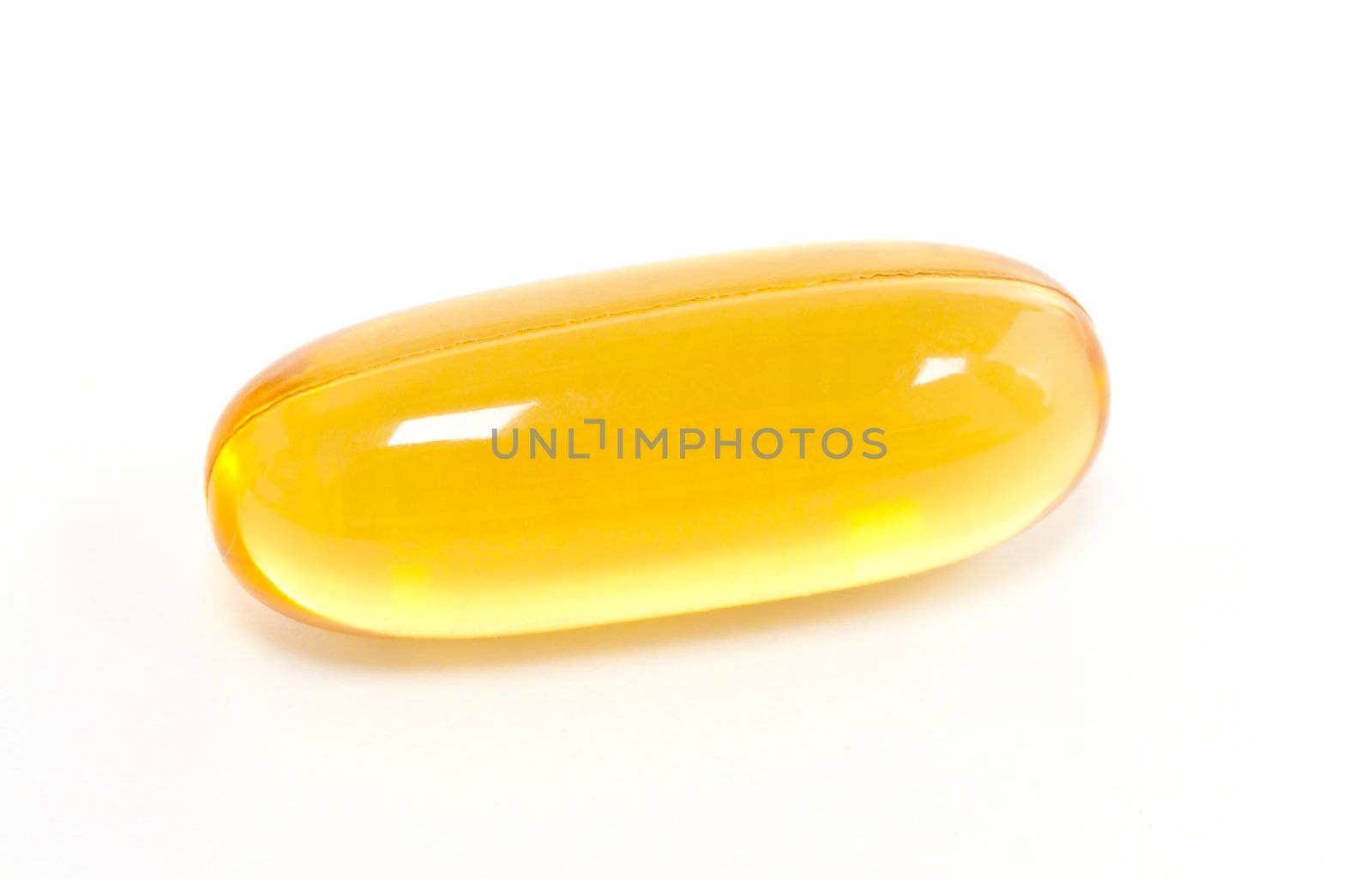 Yellow gel capsule isolated on white background