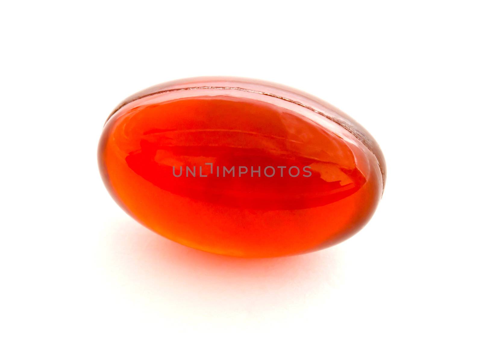 Red gel capsule isolated on white background