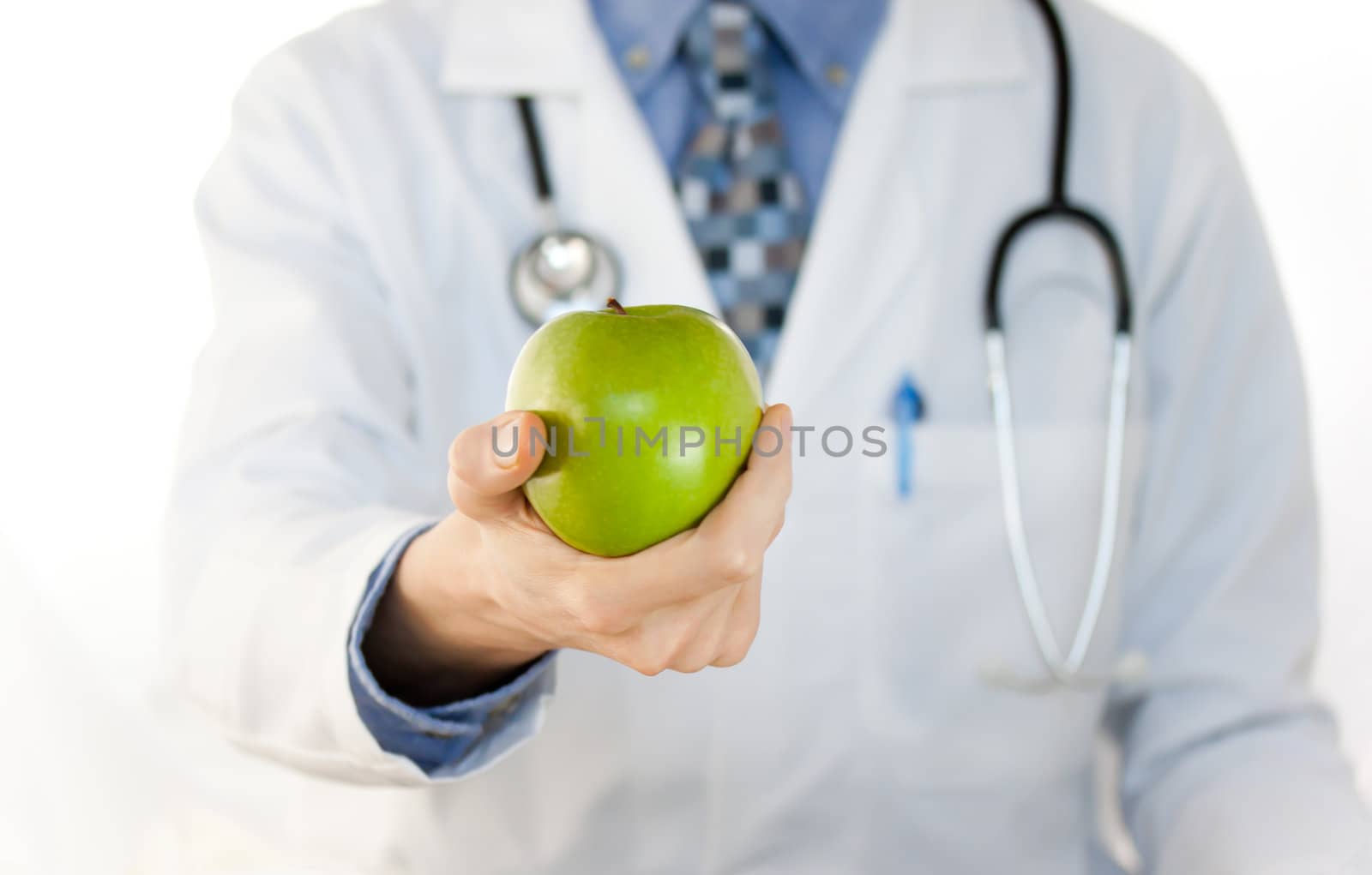 Doctor holding a green apple