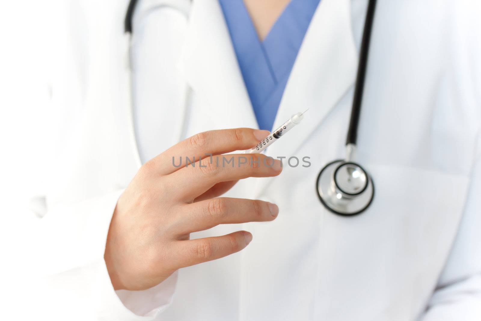 Doctor holding syringe by melpomene