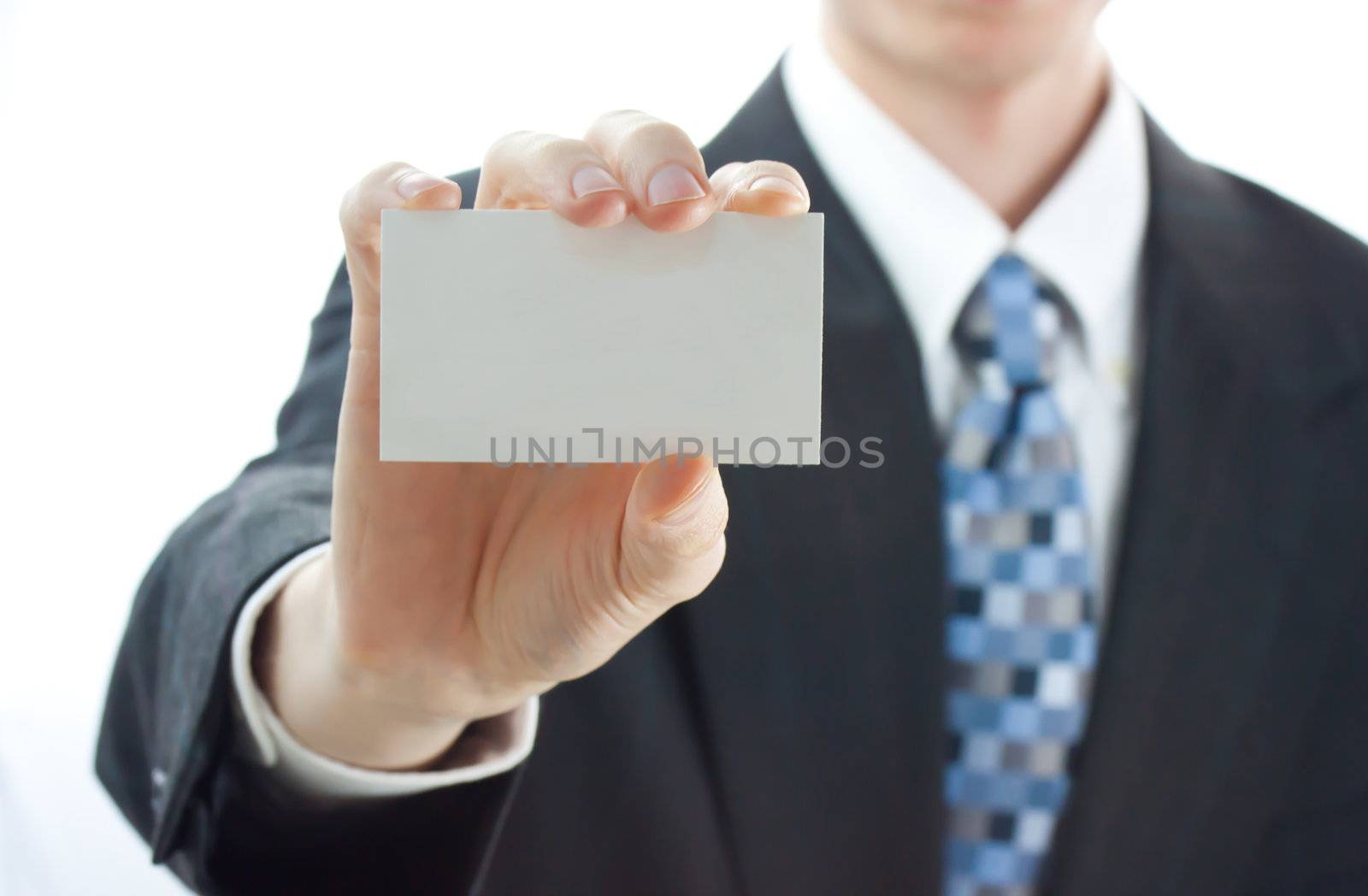 Businessman holding business card over white background