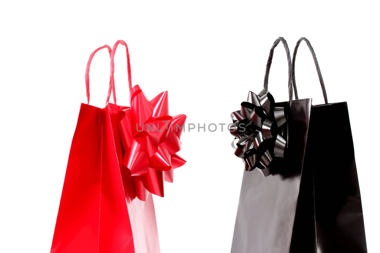 Black and red shopping bags over white background