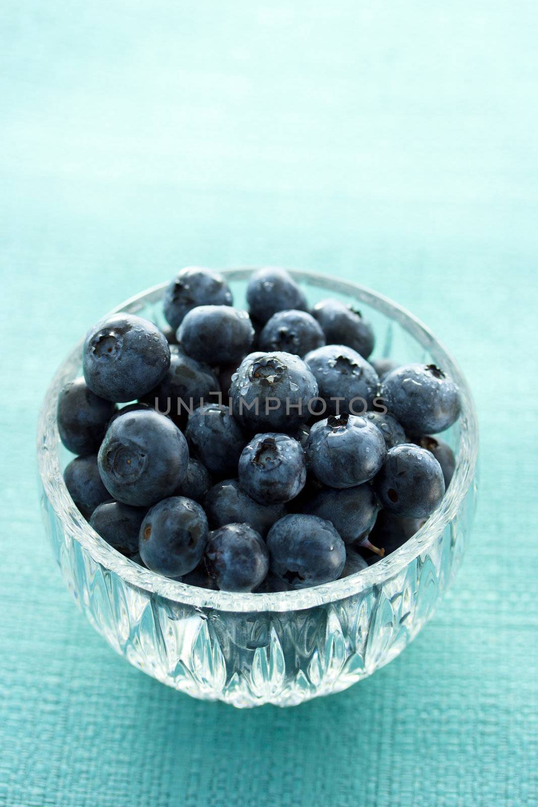 Fresh blueberries in the glass cup