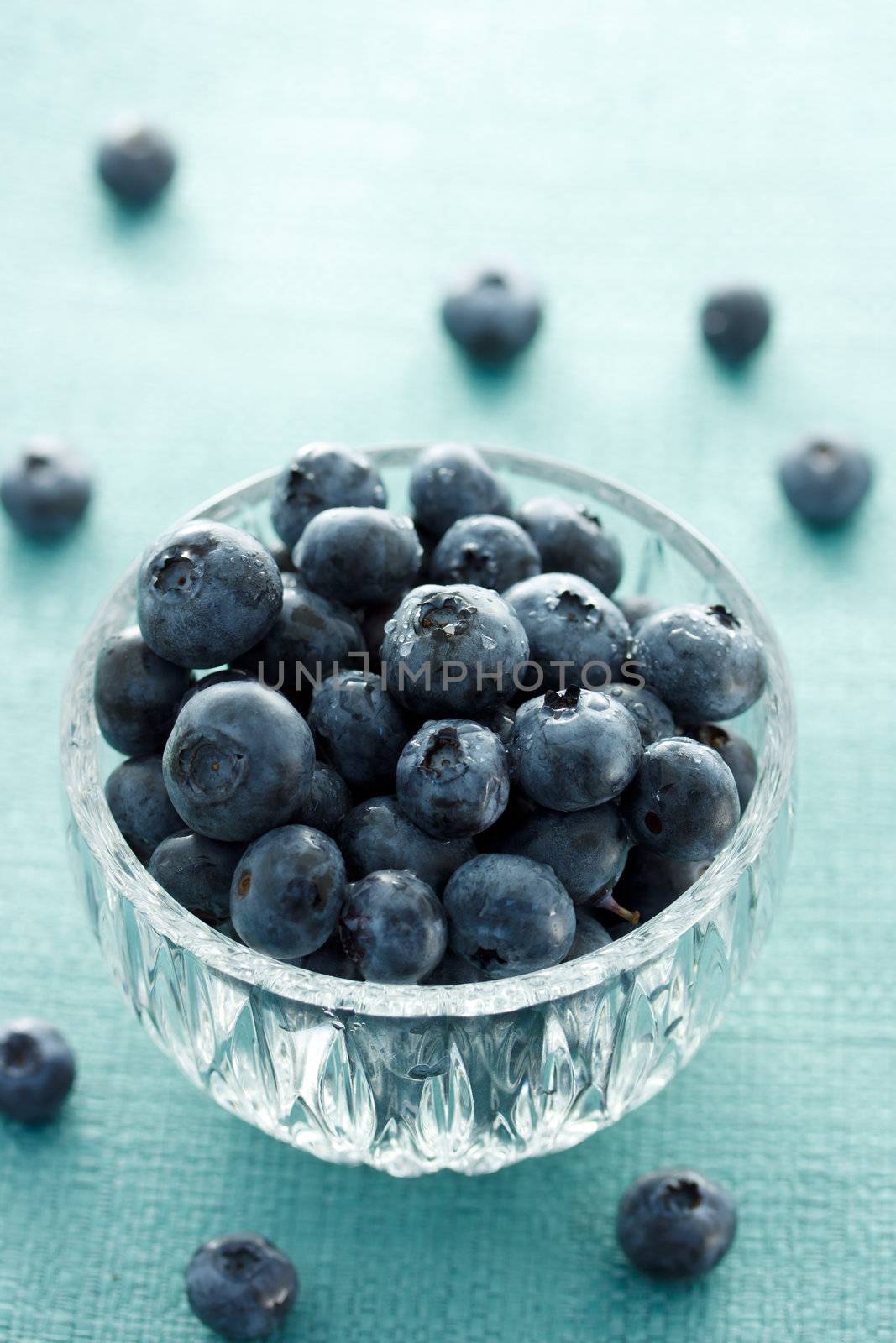 Fresh blueberries in glass cup