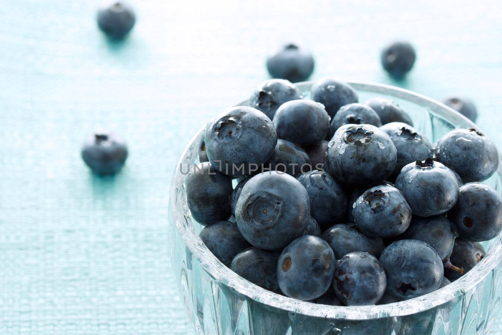 Fresh blueberries in the glass cup