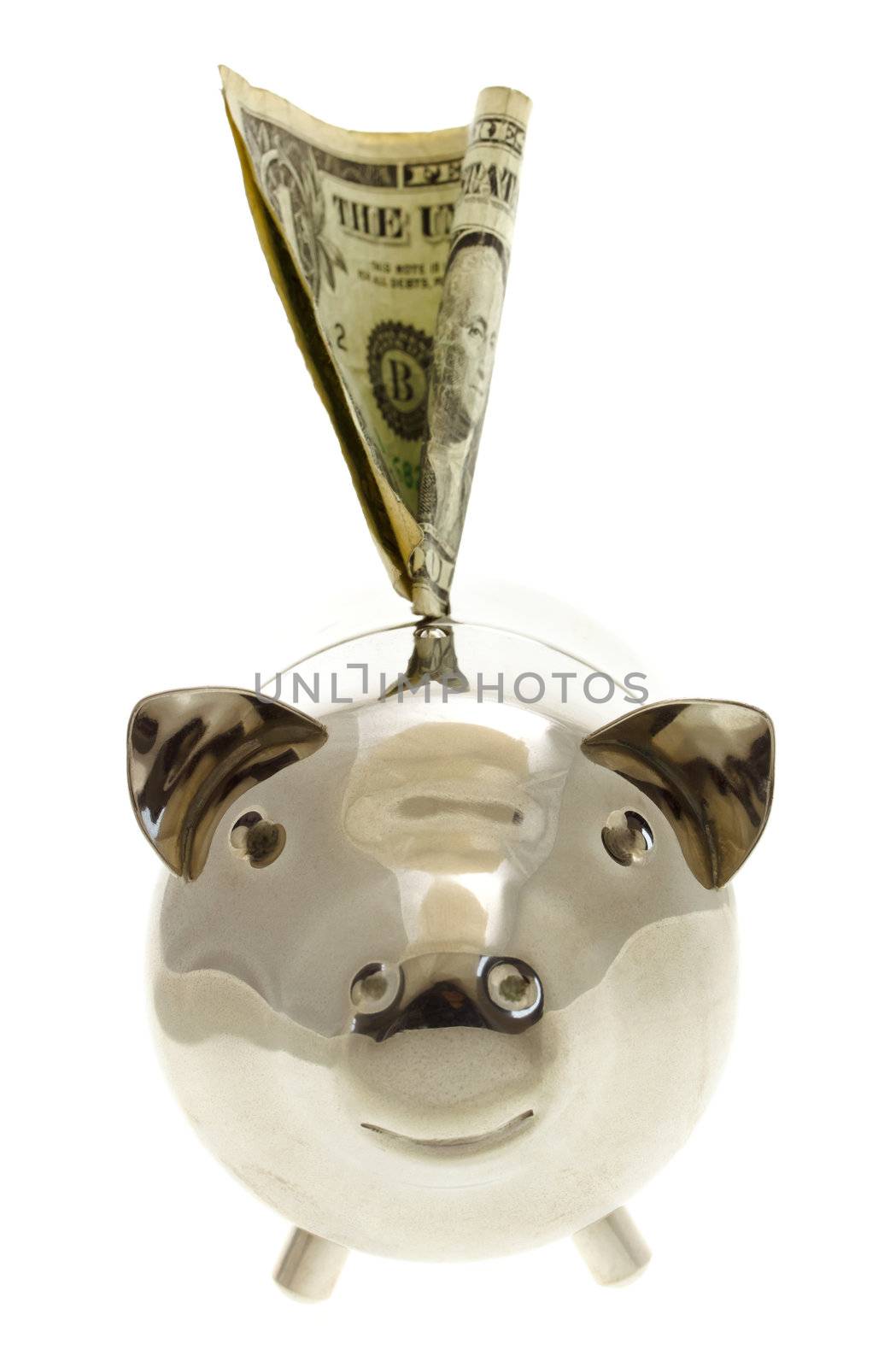 Piggy bank with US one dollar bill in slot