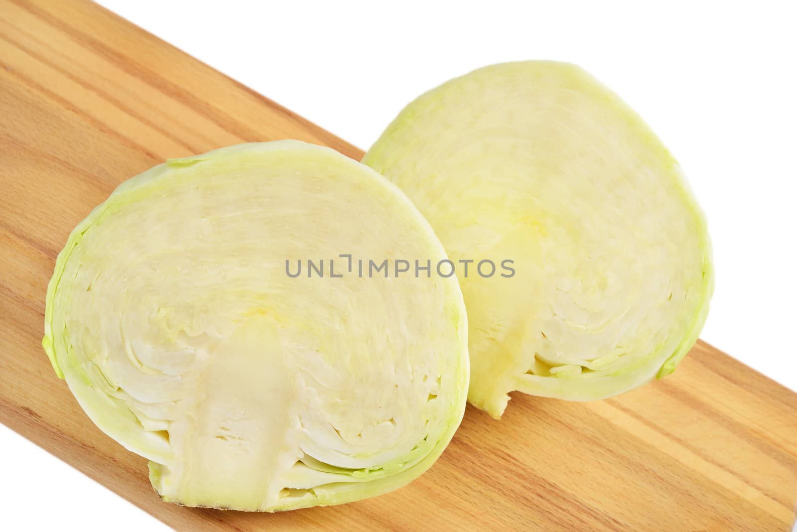 Cabbage on a cutting board. Isolated on white.