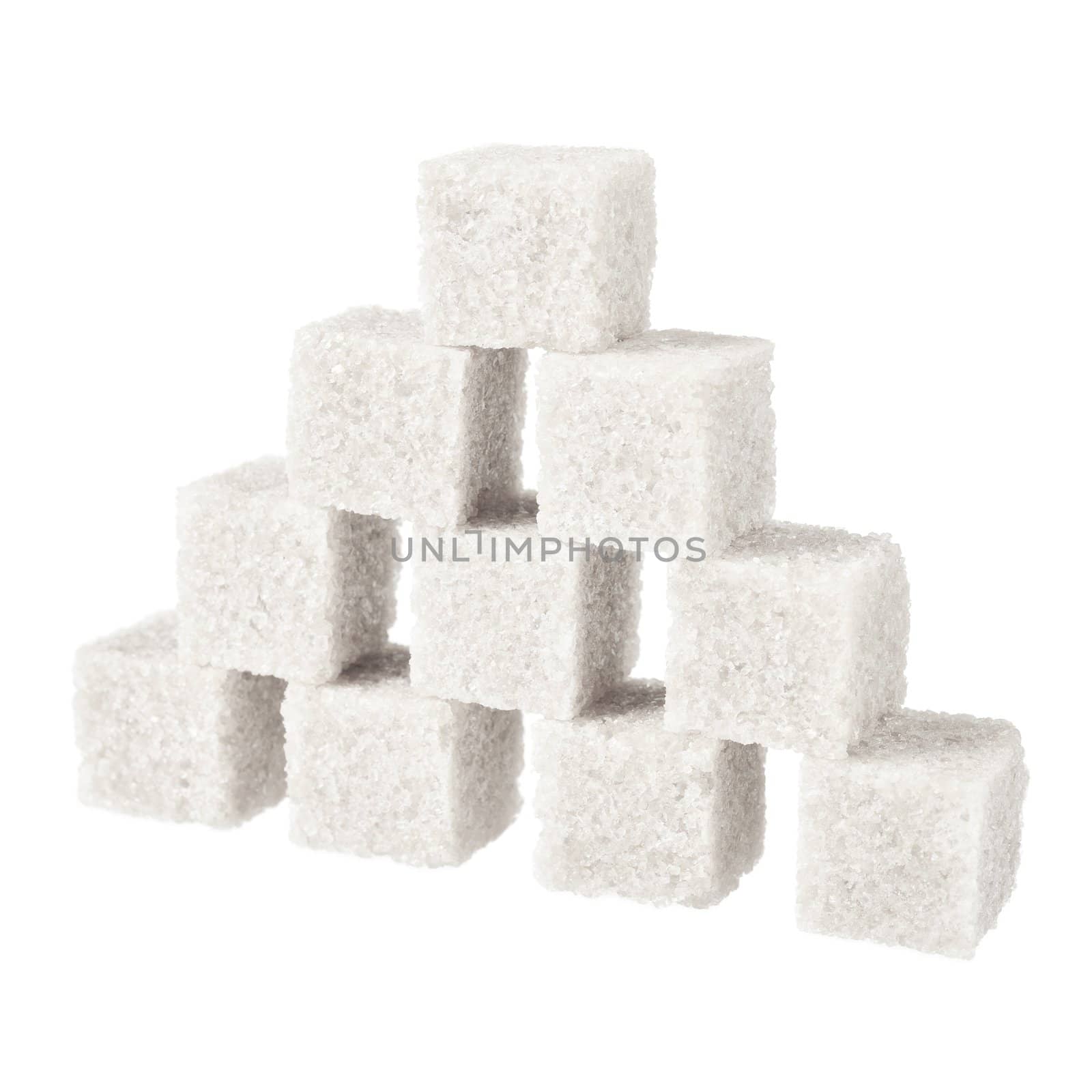 Sugar, a few pieces. Isolated on white.