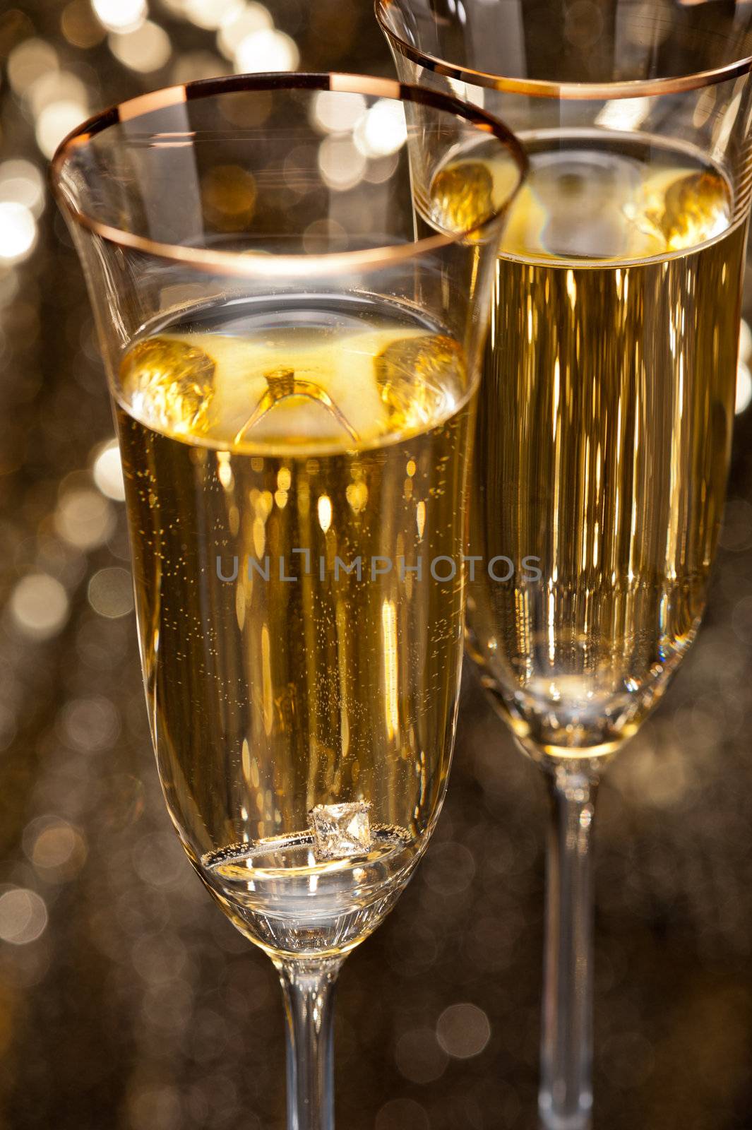 Champagne glasses with submerged ring by 3523Studio